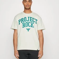 Under Armour ROCK - T-shirt Z Nadrukiem - Ivory/coastal Teal/black