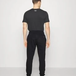 Under Armour PJT ROCK - Spodnie Treningowe - Black/white -Under Armour shop 50fa83cfc6974a3ab511abcadb339fc9 scaled
