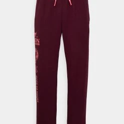 Under Armour TERRY - Spodnie Treningowe - Dark Maroon/deco Rose 4 Under Armour TERRY - Spodnie Treningowe - Dark Maroon/deco Rose -Under Armour shop 5b2beb81e9f44ded833023c6e31b9a63 scaled