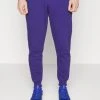 Under Armour RIVAL JOGGERS - Spodnie Treningowe - Sonar Blue/onyx White