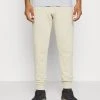 Under Armour RIVAL JOGGERS - Spodnie Treningowe - Khaki Base/onyx White
