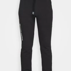 Under Armour SUMMIT - Spodnie Treningowe - Black/white -Under Armour shop 9189d530238d4706b0d04c3d5d4a9584 scaled