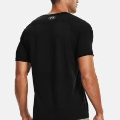 Under Armour SEAMLESS - T-shirt Z Nadrukiem - Black -Under Armour shop 95cac8eec7f24f468c856416838f0305