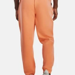 Under Armour UA SUMMIT - Spodnie Treningowe - Mellow Orange -Under Armour shop 95e29641e7ba4631ad7a4bc73bfad5e6