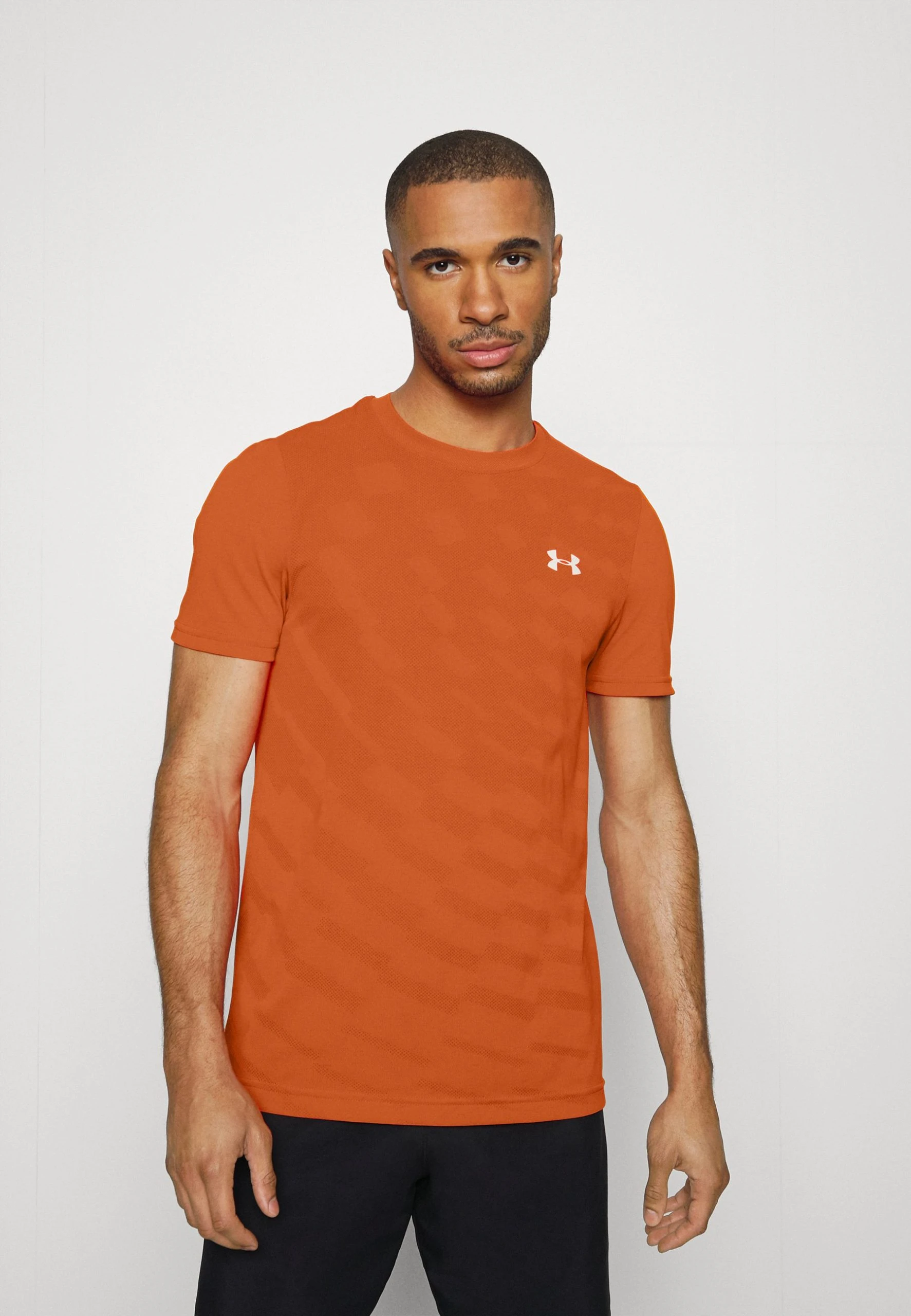 Under Armour SEAMLESS RADIAL SS - T-shirt Z Nadrukiem - Team Orange/stone 1 Under Armour SEAMLESS RADIAL SS - T-shirt Z Nadrukiem - Team Orange/stone