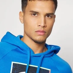 Under Armour RIVAL GRAPHIC HOODIE - Bluza - Victory Blue/white -Under Armour shop b799a6e50d9c4a5ebb679d8fe46948db scaled