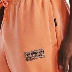 Under Armour UA SUMMIT - Spodnie Treningowe - Mellow Orange -Under Armour shop b850e572bef7427eae9fa78748e172cf