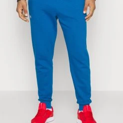 Under Armour RIVAL JOGGERS - Spodnie Treningowe - Varsity Blue/white