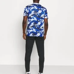 Under Armour CHALLENGER - Spodnie Treningowe - Black/white -Under Armour shop c09e659428bd481a9e641a556621fb21 scaled