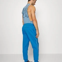 Under Armour RIVAL CHROMA PANTS - Spodnie Treningowe - Victory Blue/black -Under Armour shop d3f2f3afe3fa44b983ee865e106076f5 scaled