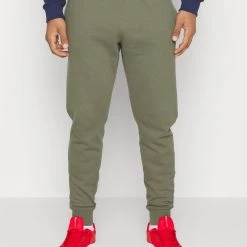 Under Armour RIVAL JOGGERS - Spodnie Treningowe - Marine Od Green/white